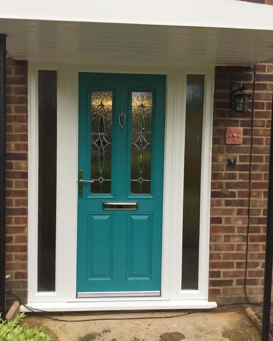 Teal composite door door with silver features installed in Crawley West Sussex