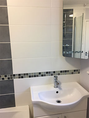 Bathroom Installation in Horsham with tiled mosaic border