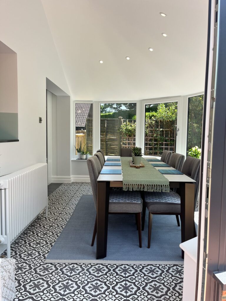 Home refurbishment Crawley 12 Dining table in the refurbished conservatory with recessed downlights